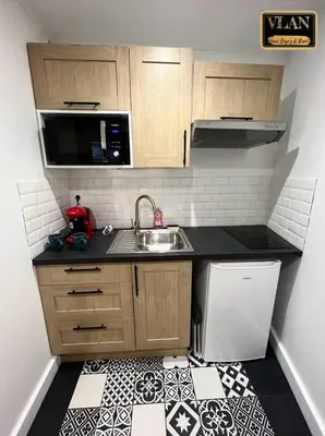 Cuisine ou kitchenette dans l'établissement Le paradize