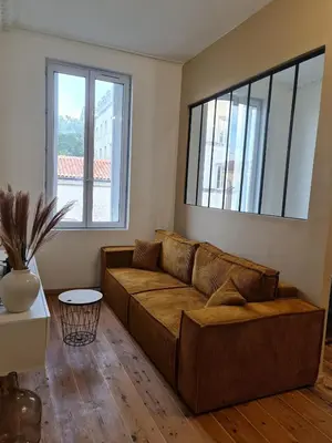 Coin salon dans l'établissement Chanzy Immo