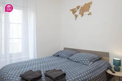 Un ou plusieurs lits dans un hébergement de l'établissement Huka Studio - Centre Ville Poitiers