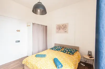Un ou plusieurs lits dans un hébergement de l'établissement Uluru - Centre Ville - Poitiers