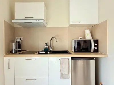 Cuisine ou kitchenette dans l'établissement Studio cosy à 2 pas de l'Espace Carat