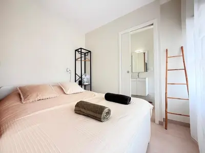 Un ou plusieurs lits dans un hébergement de l'établissement Studio cosy à 2 pas de l'Espace Carat