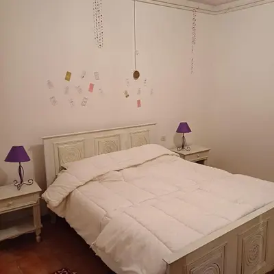 Un ou plusieurs lits dans un hébergement de l'établissement Gîte la maison du bonheur