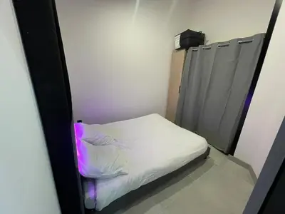 Un ou plusieurs lits dans un hébergement de l'établissement Maison à la campagne au bord de la ville