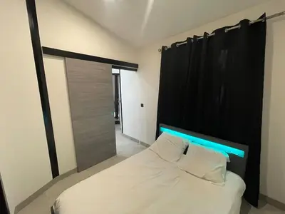 Un ou plusieurs lits dans un hébergement de l'établissement Maison à la campagne au bord de la ville