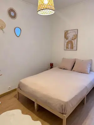 Un ou plusieurs lits dans un hébergement de l'établissement La pause Biardaise -Appartement 2 chambres à Biard