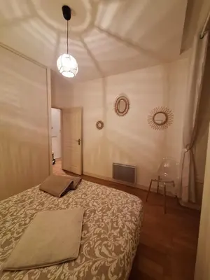 Un ou plusieurs lits dans un hébergement de l'établissement Le Clémenceau face à la Charente 2 chambres