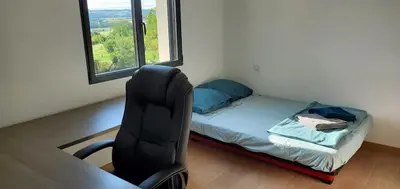 Un ou plusieurs lits dans un hébergement de l'établissement Magnifique villa 5 étoiles avec piscine proche Futuroscope & Golf