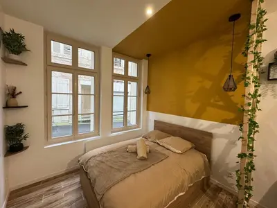 Un ou plusieurs lits dans un hébergement de l'établissement Studio hyper centre le Cosy
