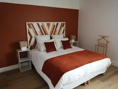Un ou plusieurs lits dans un hébergement de l'établissement Appart-Hôtel Rouillac