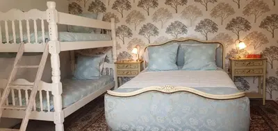 Un ou plusieurs lits dans un hébergement de l'établissement Wisteria House