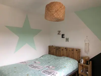 Un ou plusieurs lits dans un hébergement de l'établissement Maison de vacances