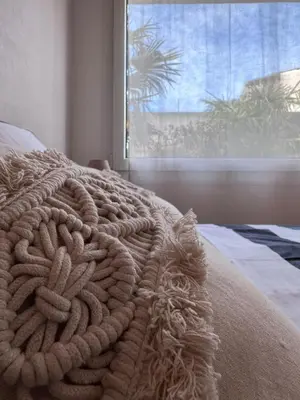 Un ou plusieurs lits dans un hébergement de l'établissement Appart-Hotel des coquillages Résidence Kiwi