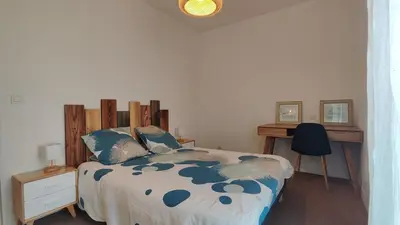 Un ou plusieurs lits dans un hébergement de l'établissement Appartement proche de La Rochelle centre