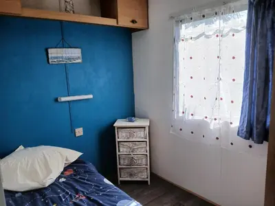 Un ou plusieurs lits dans un hébergement de l'établissement Camping de la cigogne