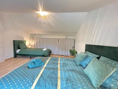Un ou plusieurs lits dans un hébergement de l'établissement Villa Verde, magnifique gite à 10 min du Futuroscope