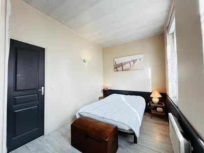 Un ou plusieurs lits dans un hébergement de l'établissement Charmante maison à 200m de la plage pour 5 personnes - FR-1-709-94