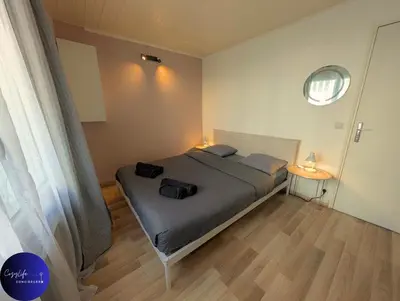 Un ou plusieurs lits dans un hébergement de l'établissement Le Jardin d'Angély by CozyLife Central Jardin