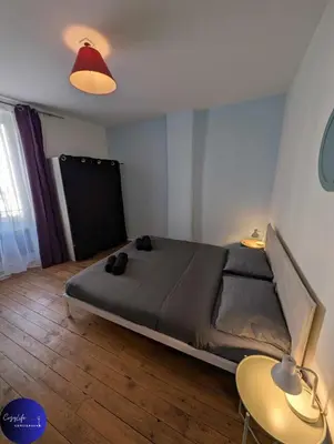 Un ou plusieurs lits dans un hébergement de l'établissement Le Jardin d'Angély by CozyLife Central Jardin