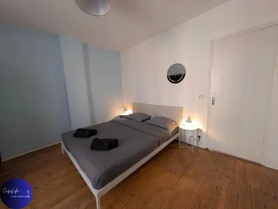 Un ou plusieurs lits dans un hébergement de l'établissement Le Jardin d'Angély by CozyLife Central Jardin