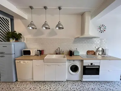 Cuisine ou kitchenette dans l'établissement Appartement cosy et atypique RDC centre ville