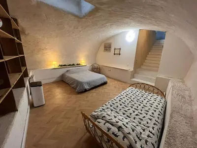 Un ou plusieurs lits dans un hébergement de l'établissement Appartement cosy et atypique RDC centre ville