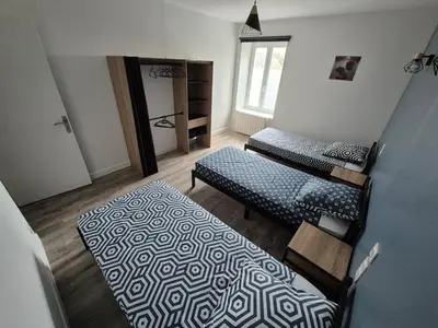 Un ou plusieurs lits dans un hébergement de l'établissement Gîte de la Minoterie