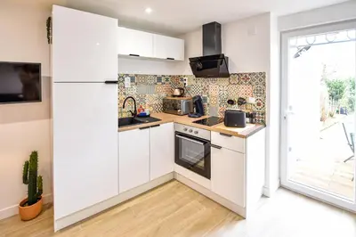 Cuisine ou kitchenette dans l'établissement Le Jardin de Frida by CozyLife - Cœur de Ville