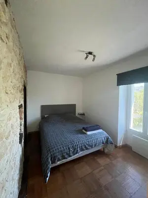 Un ou plusieurs lits dans un hébergement de l'établissement Cozy apartment Gare