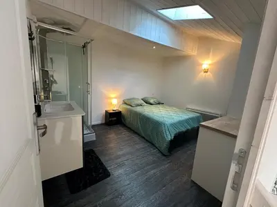 Un ou plusieurs lits dans un hébergement de l'établissement Duplex appartement