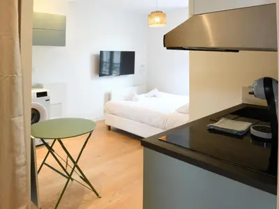 Un ou plusieurs lits dans un hébergement de l'établissement Le Cocon studio, cognac