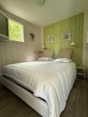 Un ou plusieurs lits dans un hébergement de l'établissement Les Cabanes du Lac à Surgères