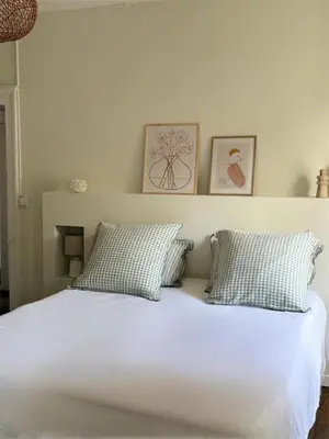 Un ou plusieurs lits dans un hébergement de l'établissement Le Clos Notre Dame hôtel particulier hypercentre