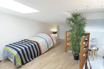 Un ou plusieurs lits dans un hébergement de l'établissement Appartement au cœur de La Rochelle avec parking