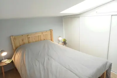Un ou plusieurs lits dans un hébergement de l'établissement Appartement au cœur de La Rochelle avec parking