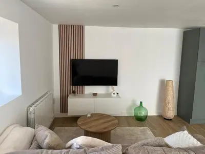 Télévision ou salle de divertissement dans l'établissement Appartement à la campagne