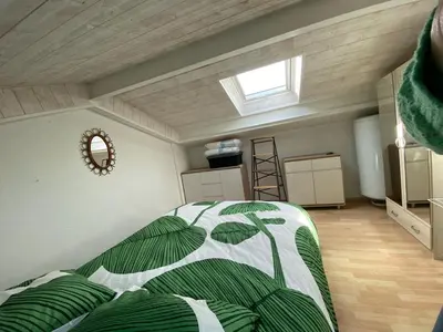 Un ou plusieurs lits dans un hébergement de l'établissement Charmant appartement au coeur de la ville