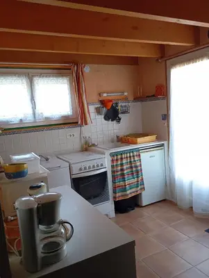 Cuisine ou kitchenette dans l'établissement Le Charmant Duplex