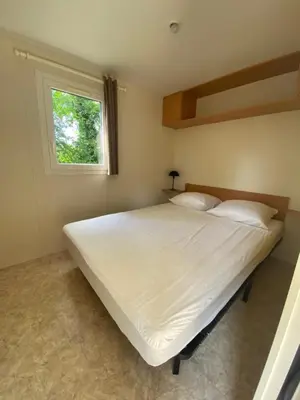 Un ou plusieurs lits dans un hébergement de l'établissement Camping du Fouilloux