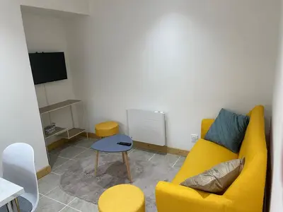 Coin salon dans l'établissement Maison mitoyenne proche Cognac