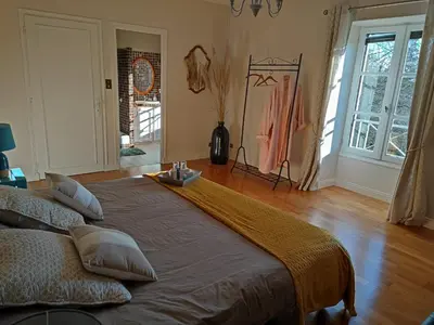 Un ou plusieurs lits dans un hébergement de l'établissement Le clos de la huppe - suite familiale