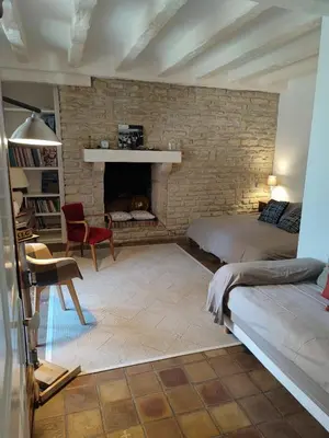 Coin salon dans l'établissement La Huppe - Chambre d'hote