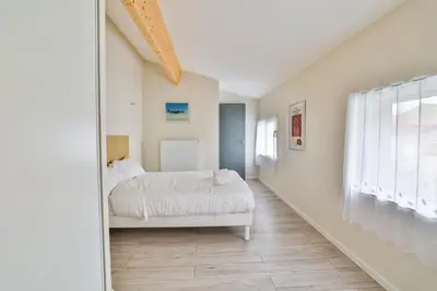 Un ou plusieurs lits dans un hébergement de l'établissement La Jarnacaise #12pers #6 chambres