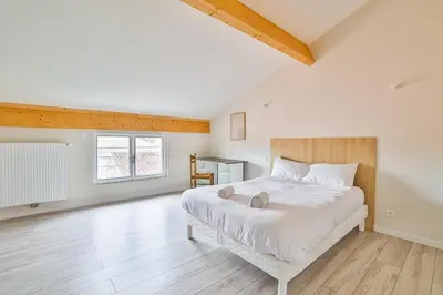 Un ou plusieurs lits dans un hébergement de l'établissement La Jarnacaise #12pers #6 chambres