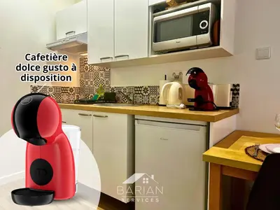 Cuisine ou kitchenette dans l'établissement Maisonnette avec climatisation et cour - ménage et linge inclus