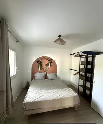 Un ou plusieurs lits dans un hébergement de l'établissement Maison Cosy Niort parking privé 3 chambres