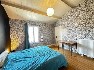 Un ou plusieurs lits dans un hébergement de l'établissement Spacieuse Maison 4 Chambres, Centre Fouras, Proche Plages - FR-1-709-96