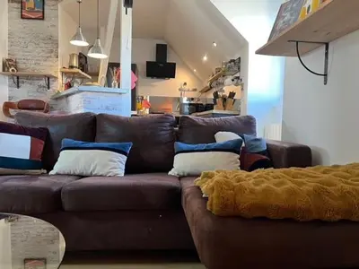 Coin salon dans l'établissement Bel appartement proche du marché