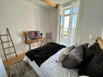 Télévision ou salle de divertissement dans l'établissement La Villa Ô Dunes Front de Mer
