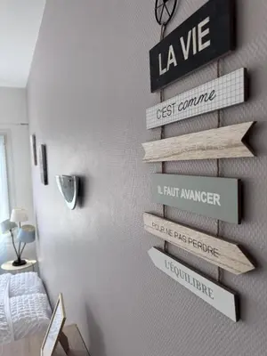 Un ou plusieurs lits dans un hébergement de l'établissement Appart-Hotel du drapeau bleu Residence Kiwi